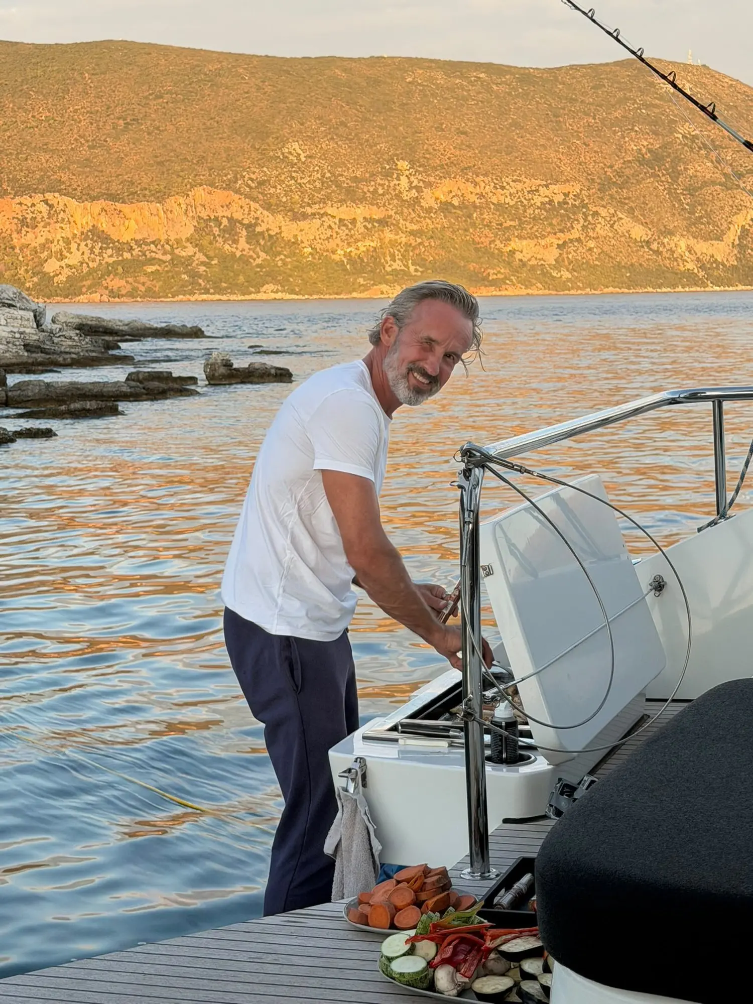 Healthy barbecue on board the catamaran at sunset during Fit at sea