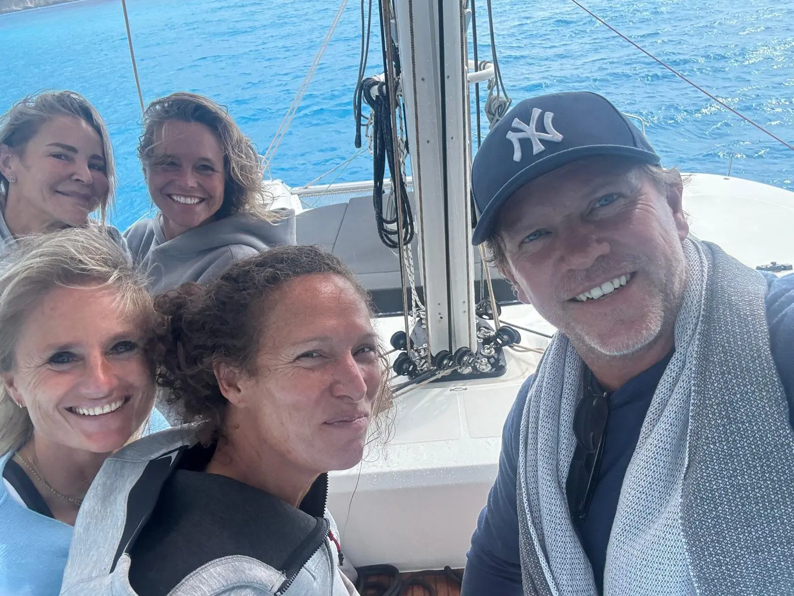 Group selfie on the DAY ONE NEXT LEVEL catamaran during Fit at sea